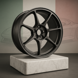 Forged magnesium wheel with Italian flag and sports car silhouette in background