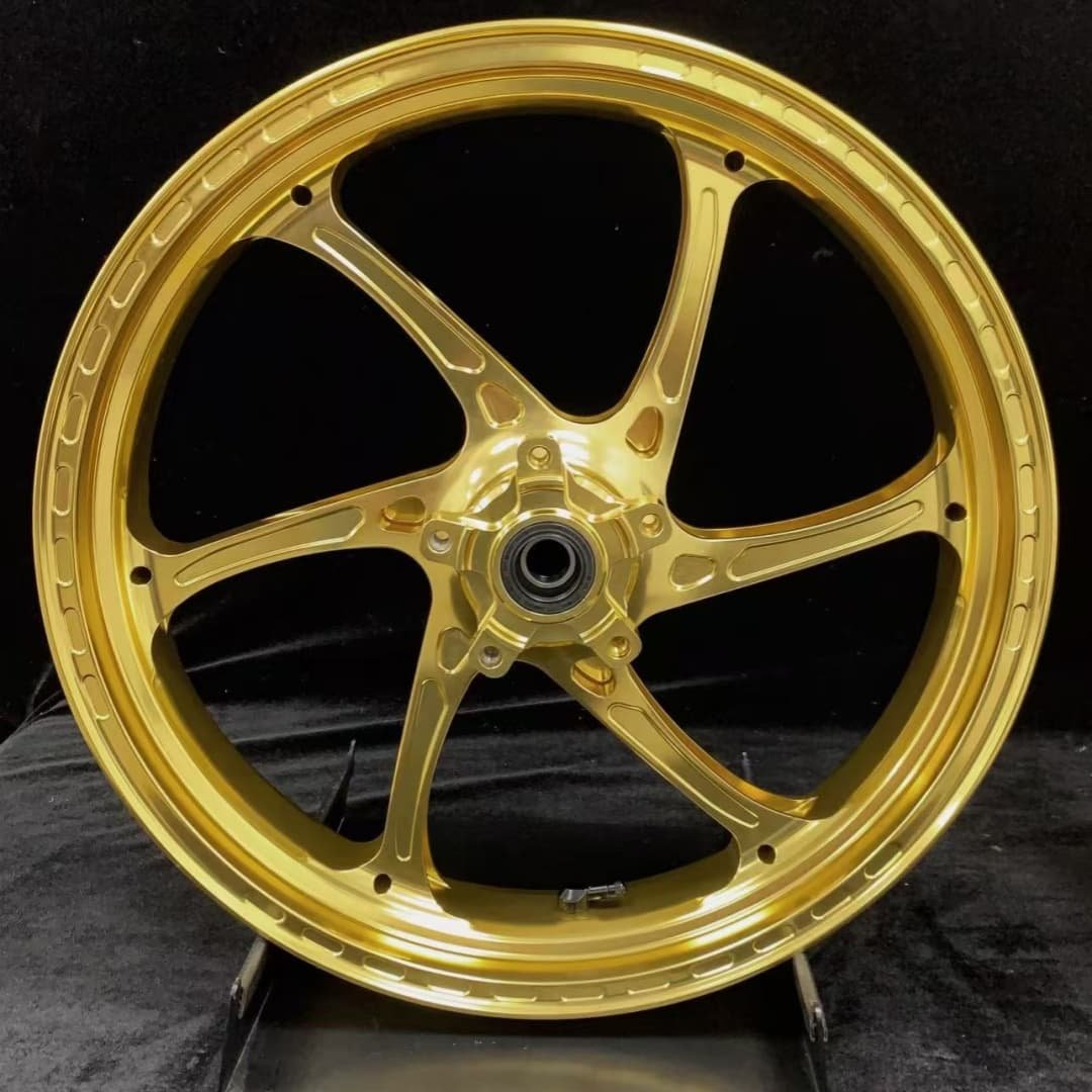 Gold anodized forged front wheel for TRIUMPH 765RS featuring precision-machined 6-spoke design