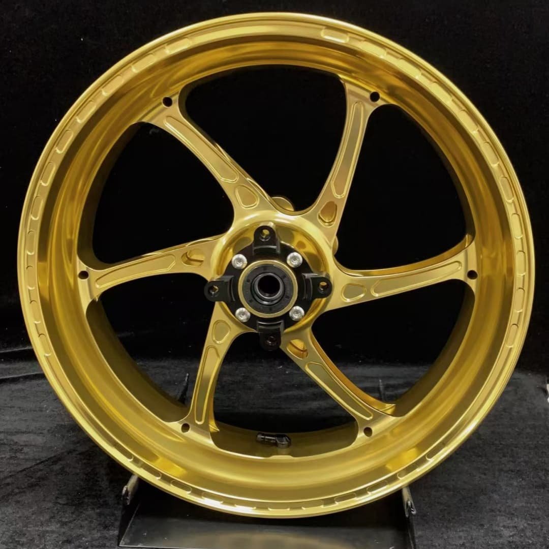 TRIUMPH 765RS forged rear motorcycle wheel in gold finish with black center hub and 6-spoke structure