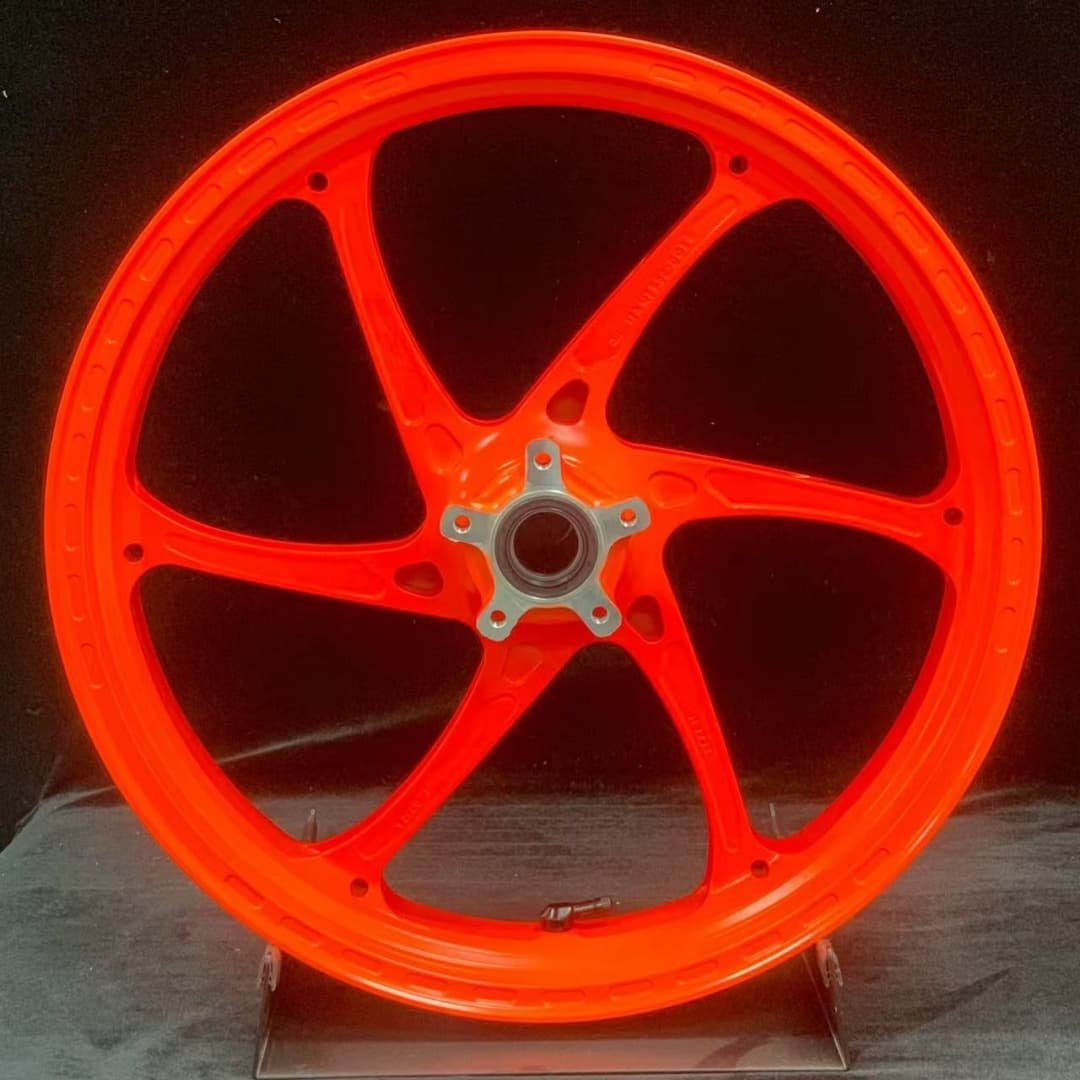 CNC forged front wheel for KTM 790 / 890 with signature orange KTM color and silver hub