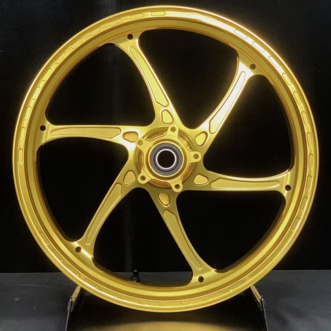 High-performance forged front wheel for Ducati MULTISTRADA V4 – anodized gold finish with precision CNC-spoke structure