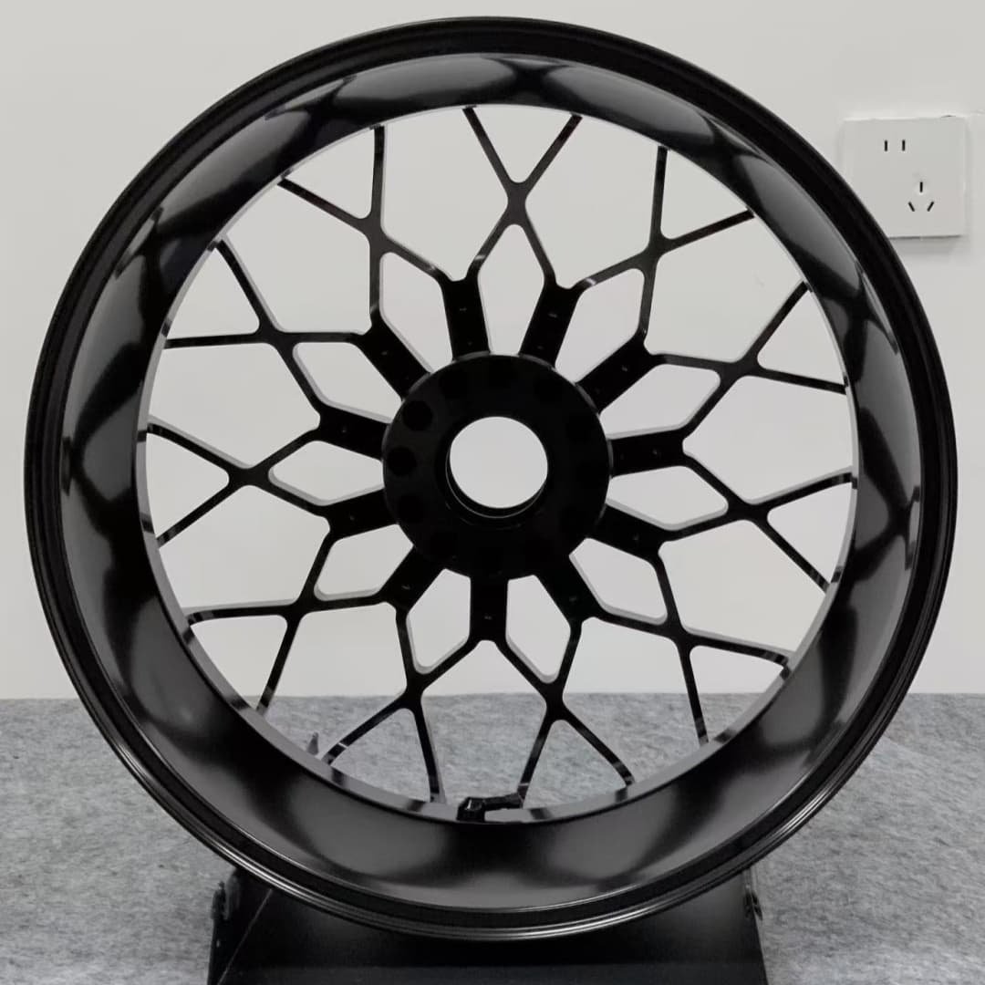 Black forged rear wheel for Ducati MULTISTRADA V4 – complex web-style design optimized for strength and airflow