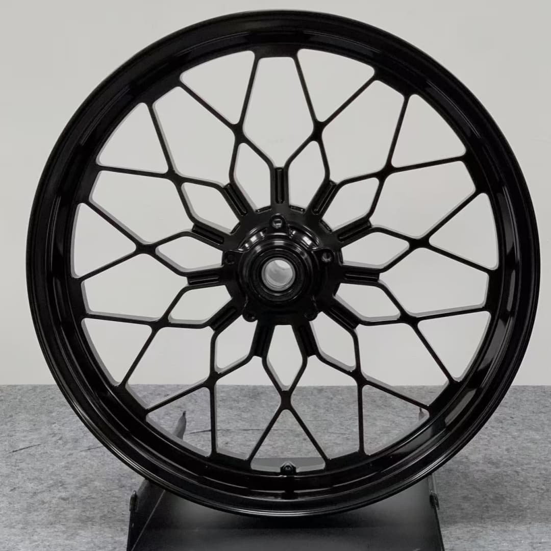 Pre-assembled forged front wheel for Ducati MULTISTRADA V4 – black spider-web spoke configuration for performance touring