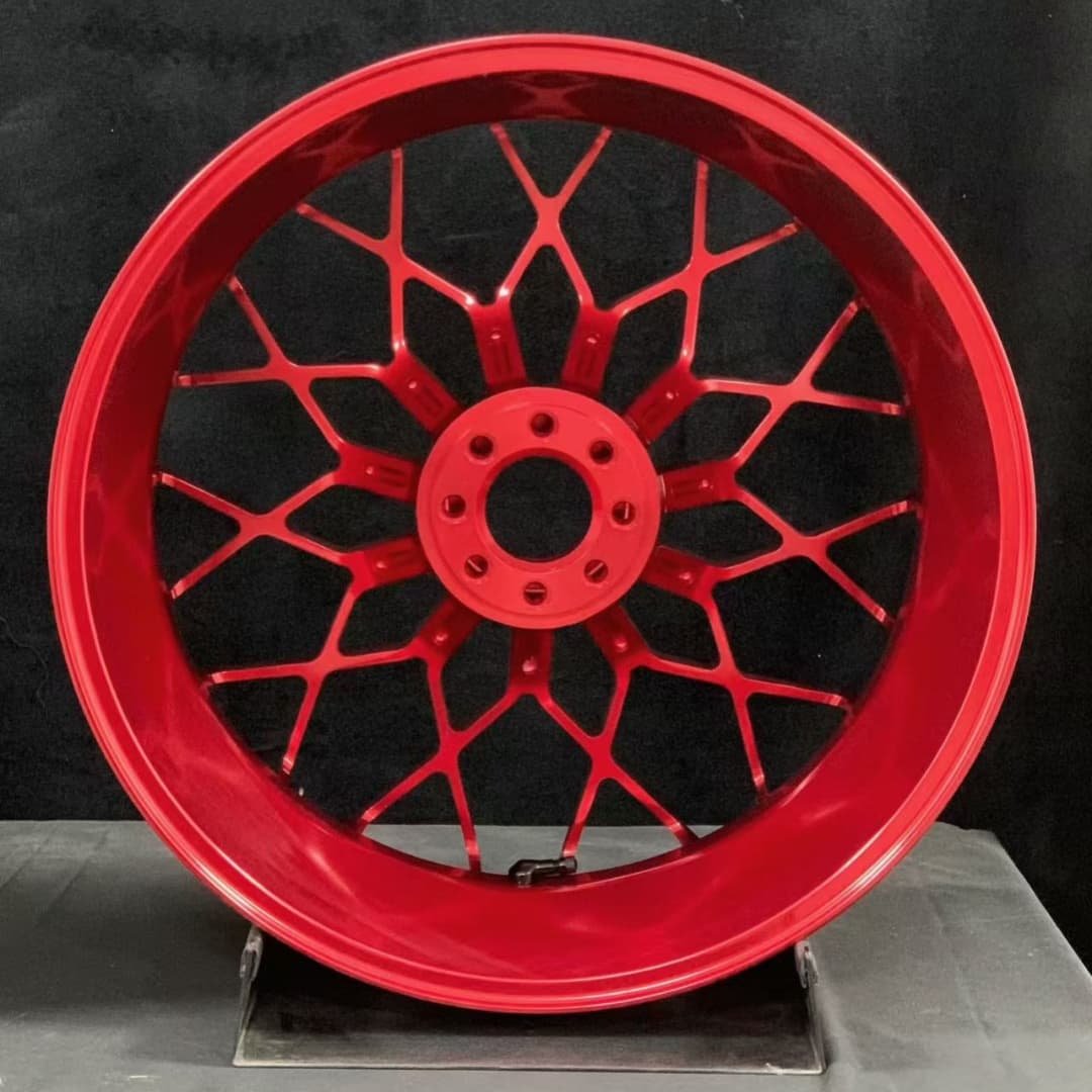 Red forged rear wheel for MV Agusta motorcycles featuring a unique mesh-style multi-spoke design
