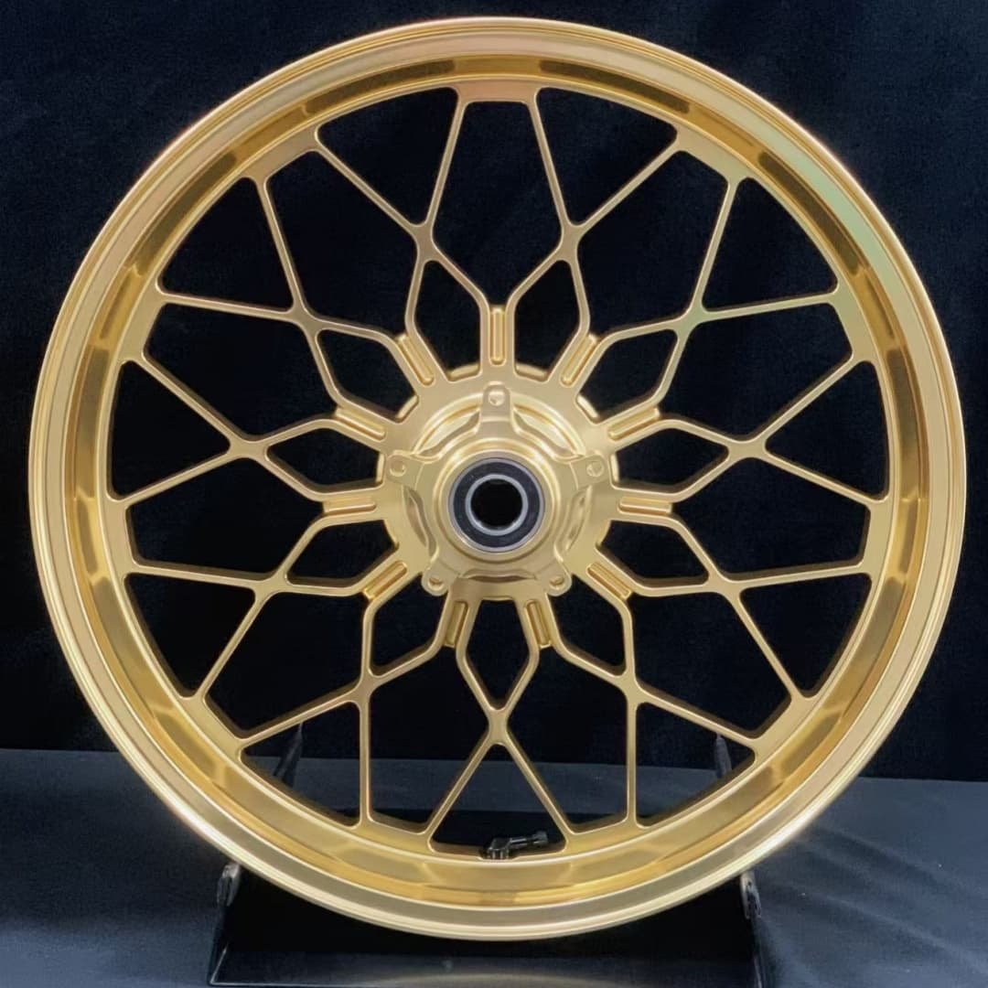 CNC gold forged front motorcycle wheel for MV Agusta with spiderweb-style multi-spoke layout
