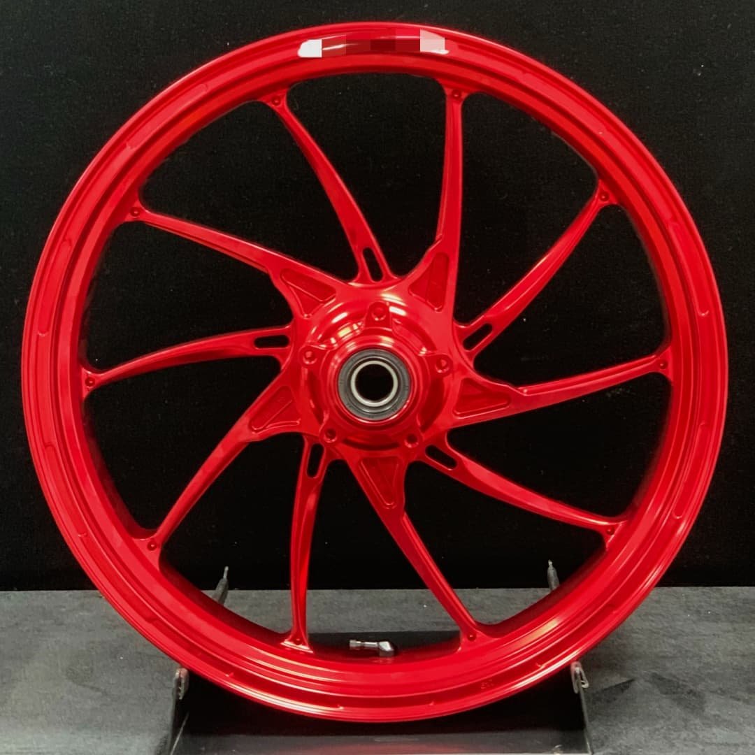 Forged front wheel for Ducati PANIGALE V4 2025 – anodized red spiral spoke design for aerodynamic stability
