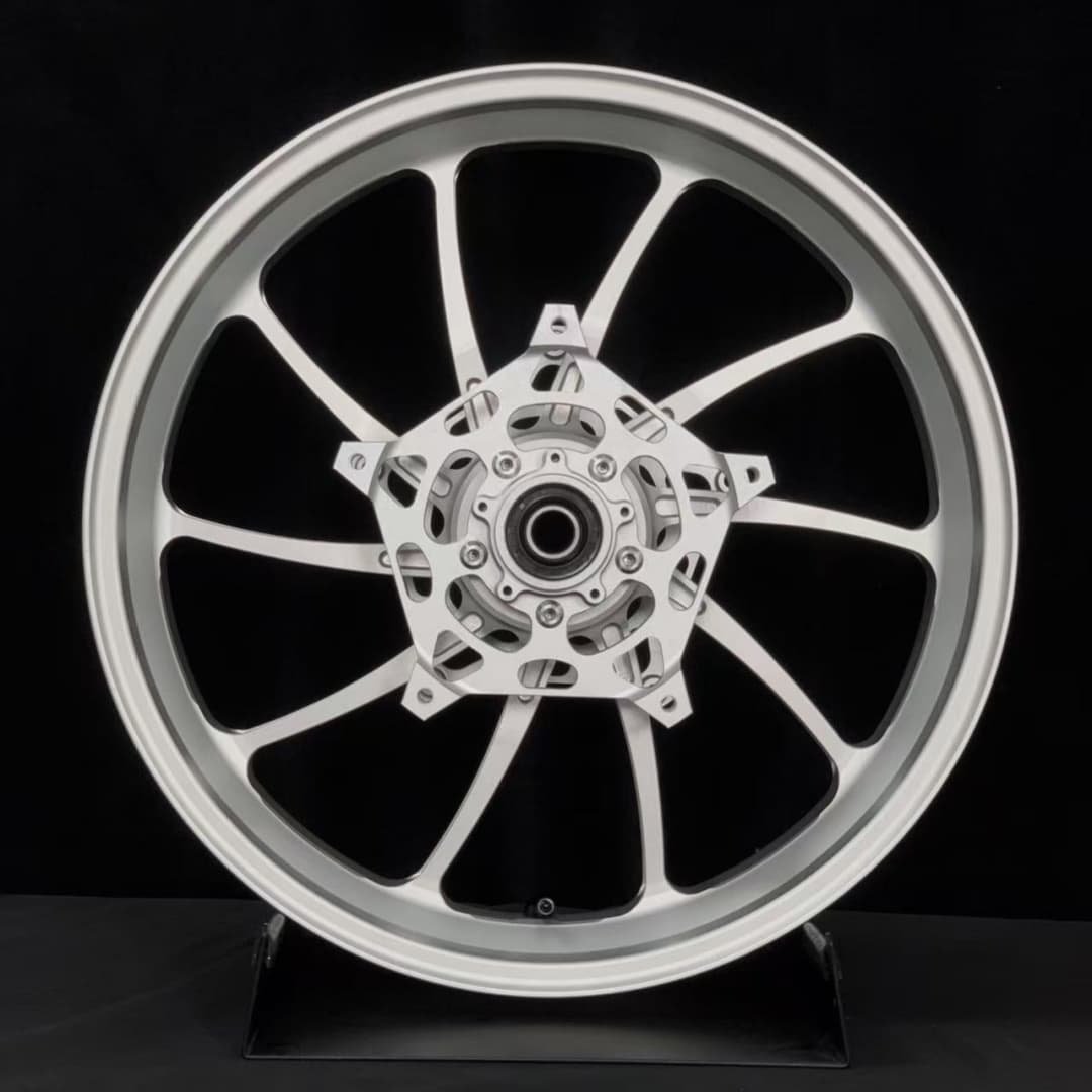 Rear forged wheel for BMW R1250RT motorcycle with integrated cush drive and silver machined finish