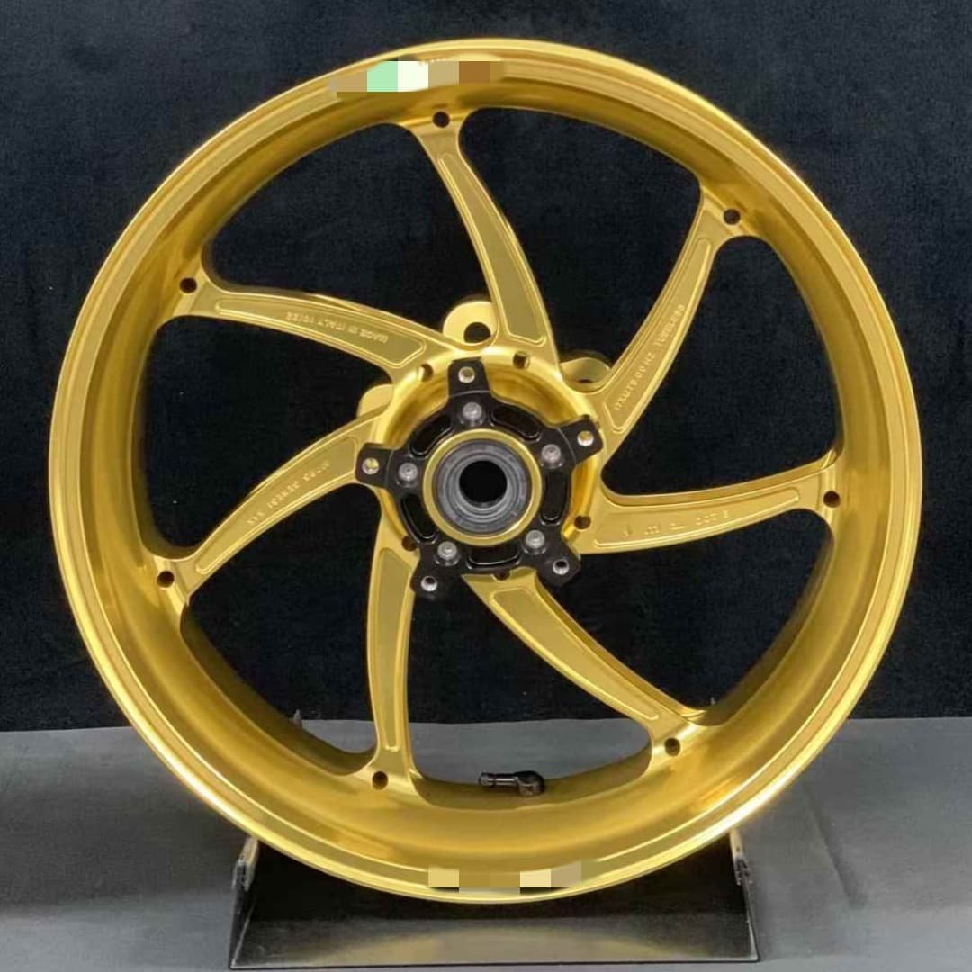 Gold forged motorcycle wheel for Aprilia RSV4 with precision-machined split-spoke design