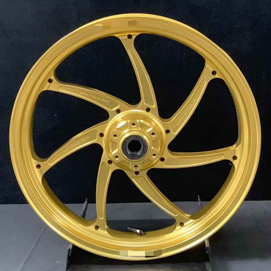 Forged lightweight front wheel for Aprilia RS660 in gold with race-style 7-spoke design
