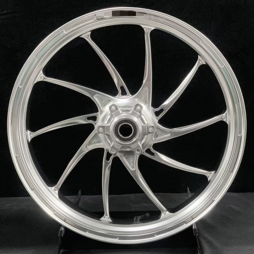 Silver forged front wheel for BMW R nineT or S1000RR with twisted spoke configuration