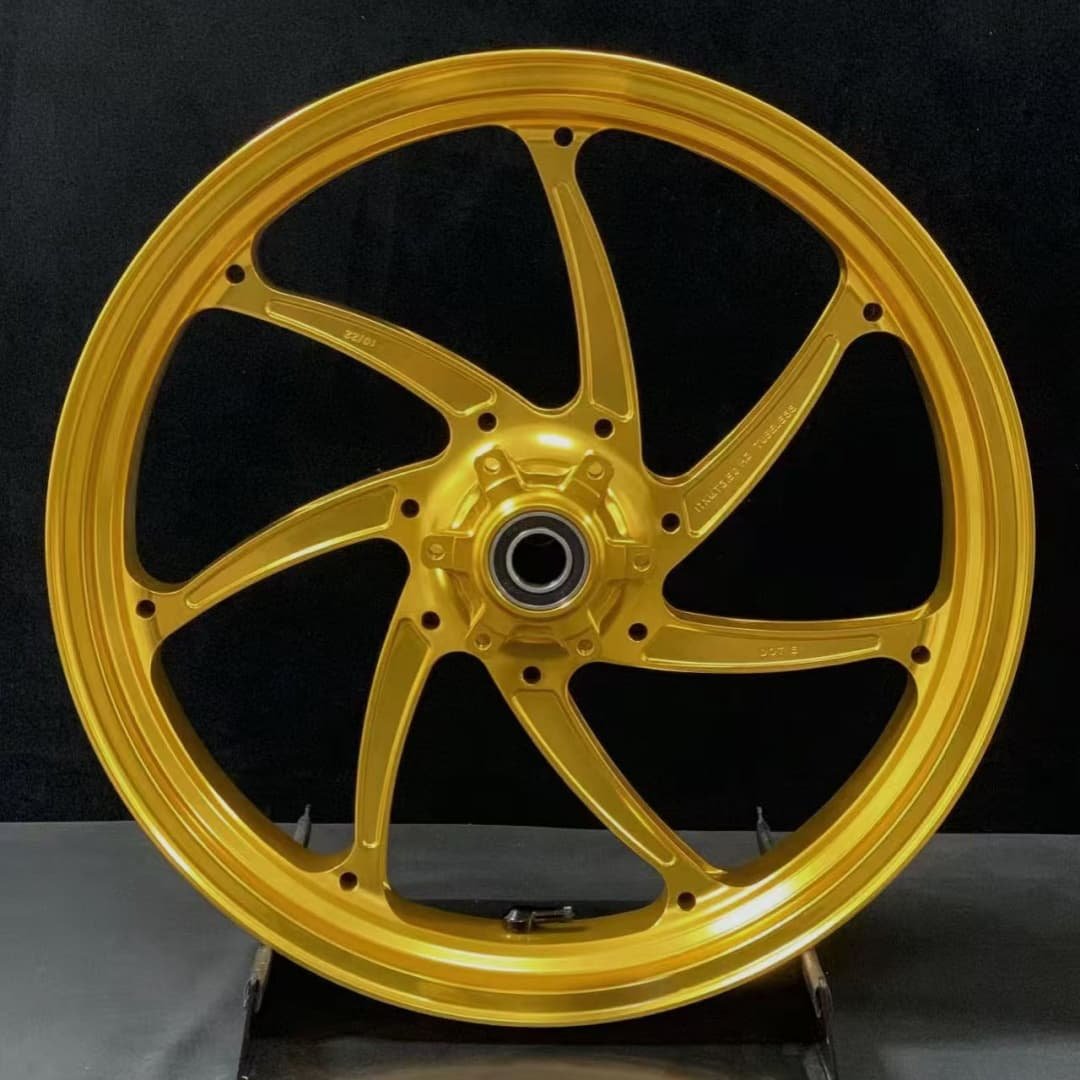 Gold forged motorcycle wheel for BMW R nineT or R1250RT with classic 7-spoke symmetric design
