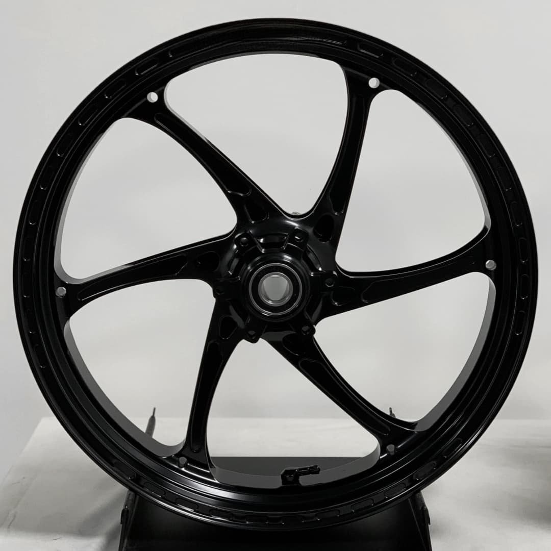 Black forged rear wheel for BMW motorcycles with clean 5-spoke layout and deep lip