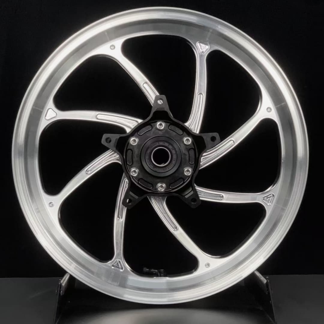 Polished forged rear wheel for Yamaha TMAX scooter with unique curved 6-spoke design