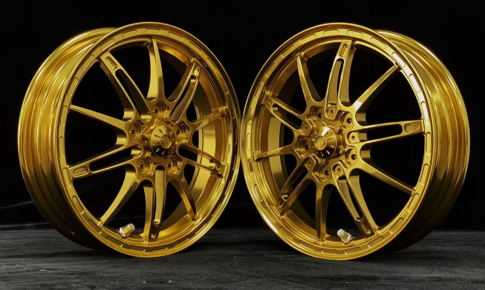 Gold forged wheels for VESPA scooter with intricate split-spoke design and high-polish finish