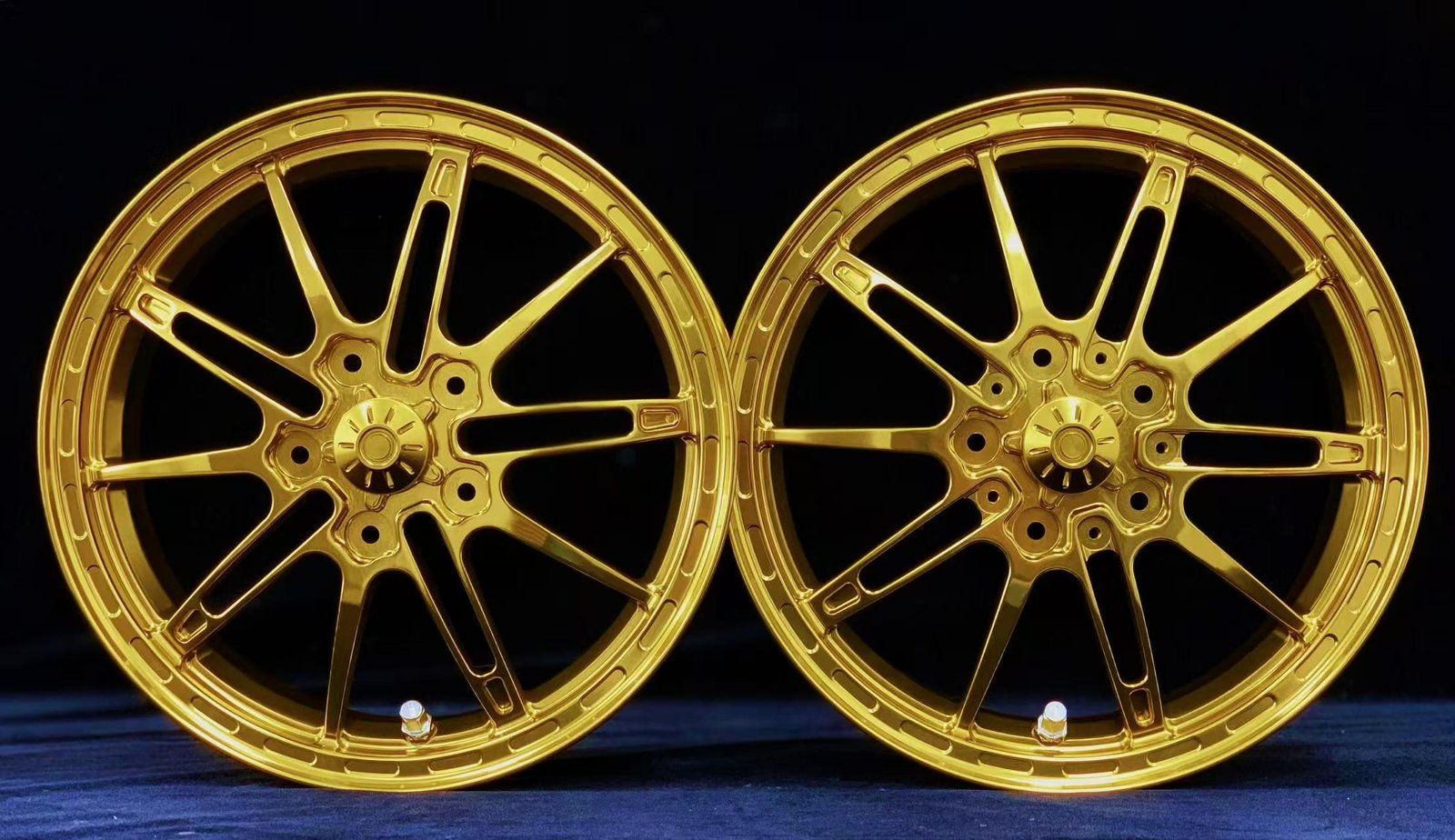 High-performance VESPA forged aluminum wheels in matching gold anodized finish, 10-spoke design