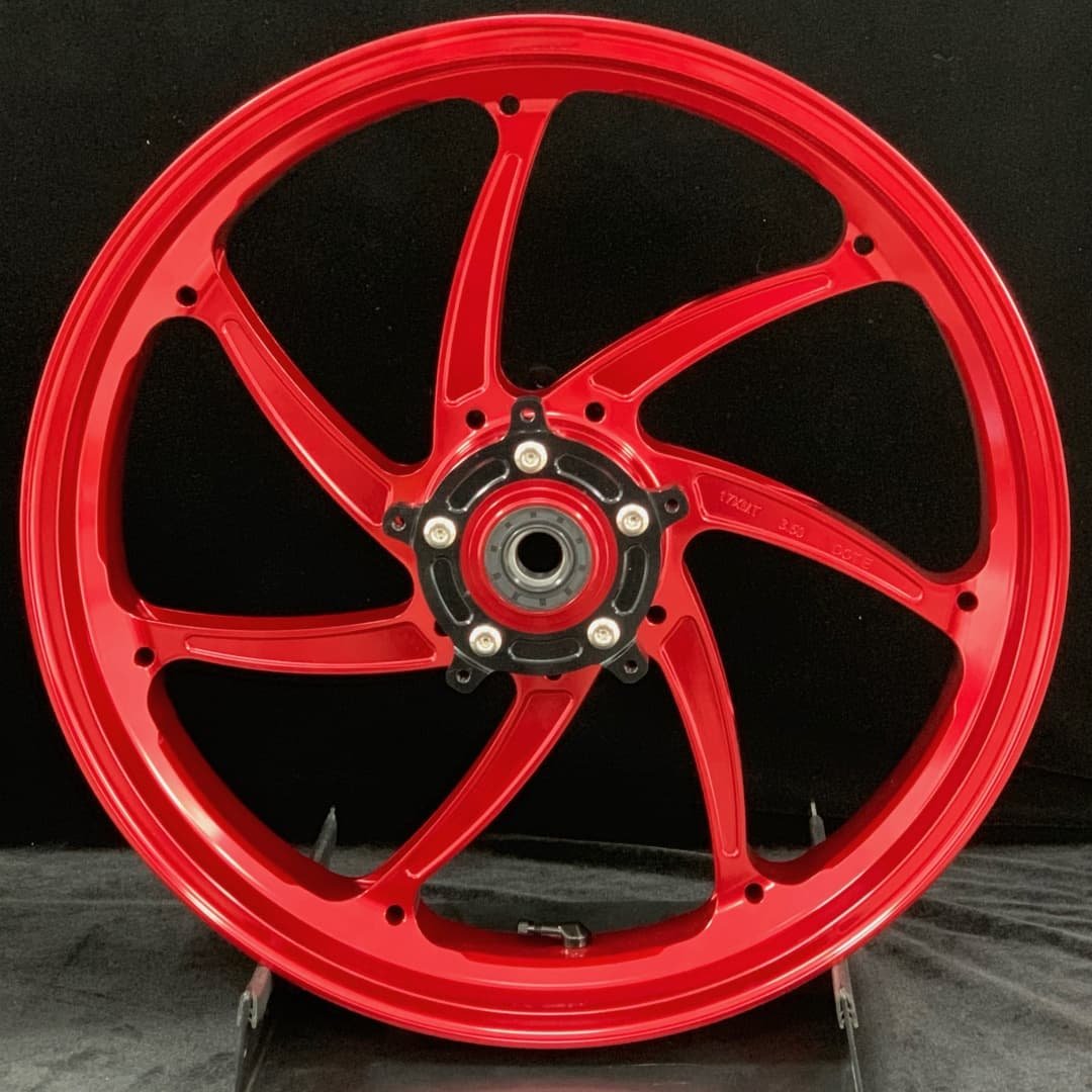 Forged front wheel for HONDA X-ADV750 – anodized red 7-spoke aluminum with black hub for urban and adventure riding