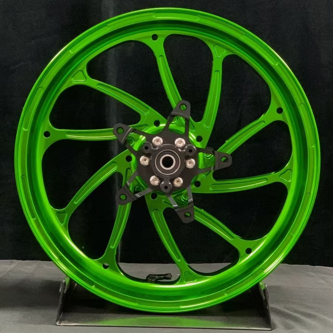 Green forged front wheel for Yamaha XMAX scooter featuring 10 lightweight performance spokes