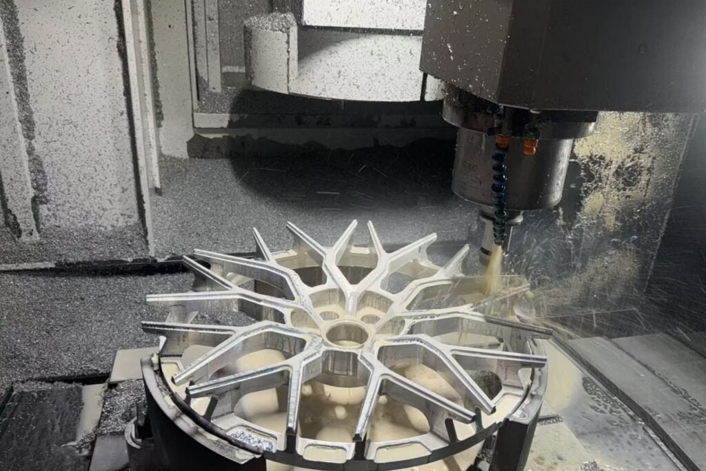 CNC machine precisely cutting forged aluminum wheels at FLEXIFORGED production facility