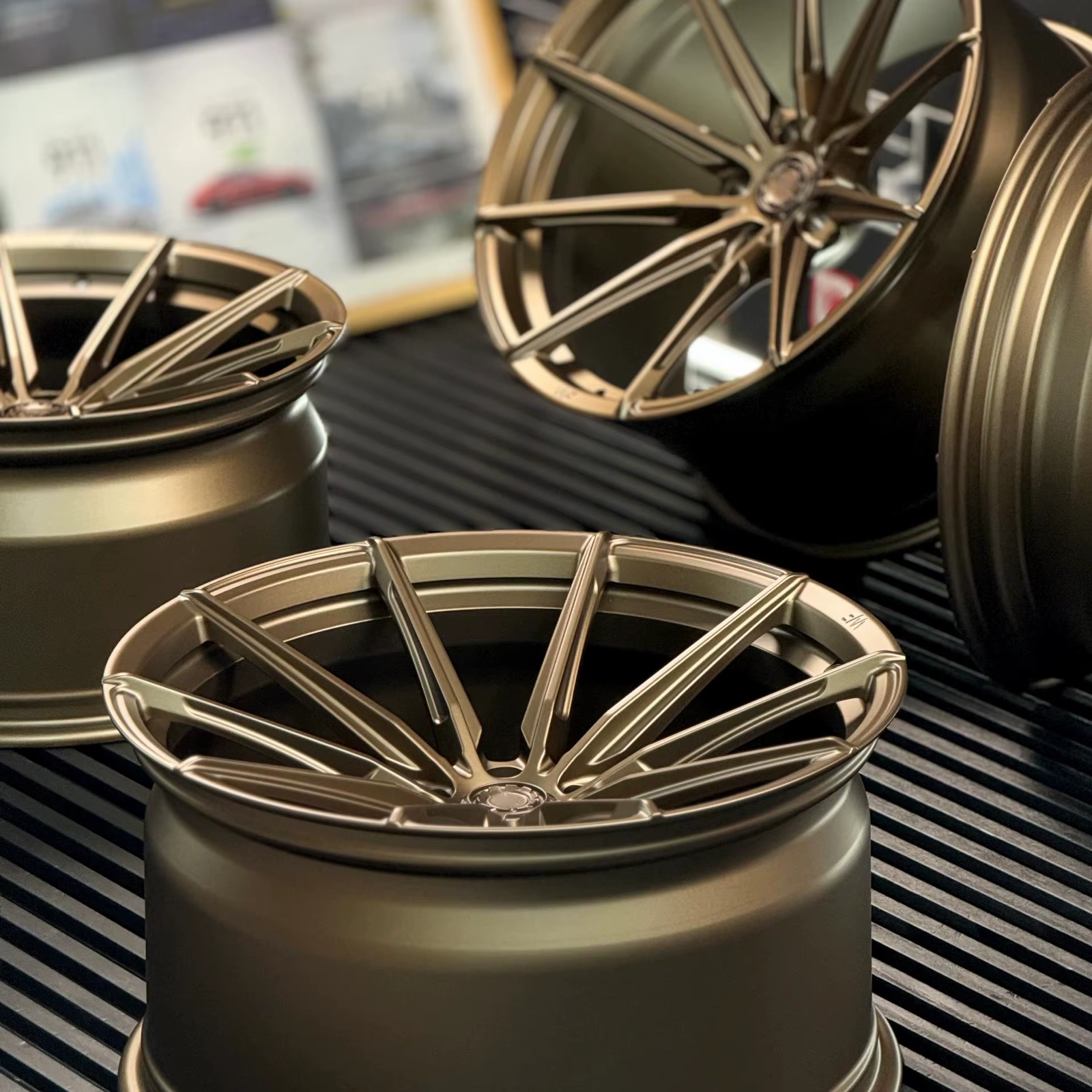 Deep concave custom forged monoblock wheels with a bronze finish and sharp multi-spoke design, crafted by FLEXIFORGED for performance and style