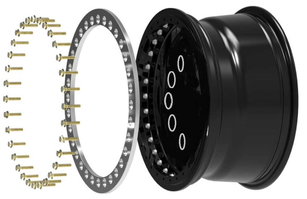 Exploded diagram of a beadlock wheel showing the assembly components including the outer ring, clamping bolts, and the black wheel rim, demonstrating how the tire bead is mechanically secured for off-road use.