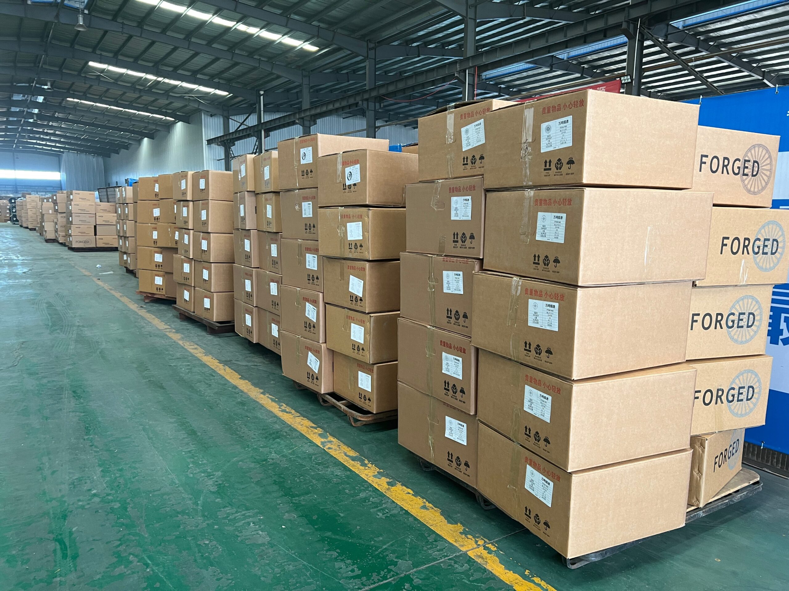 Finished forged aluminium wheels stored and staged for export order packing in the FLEXIFORGED finished goods warehouse in Chongqing