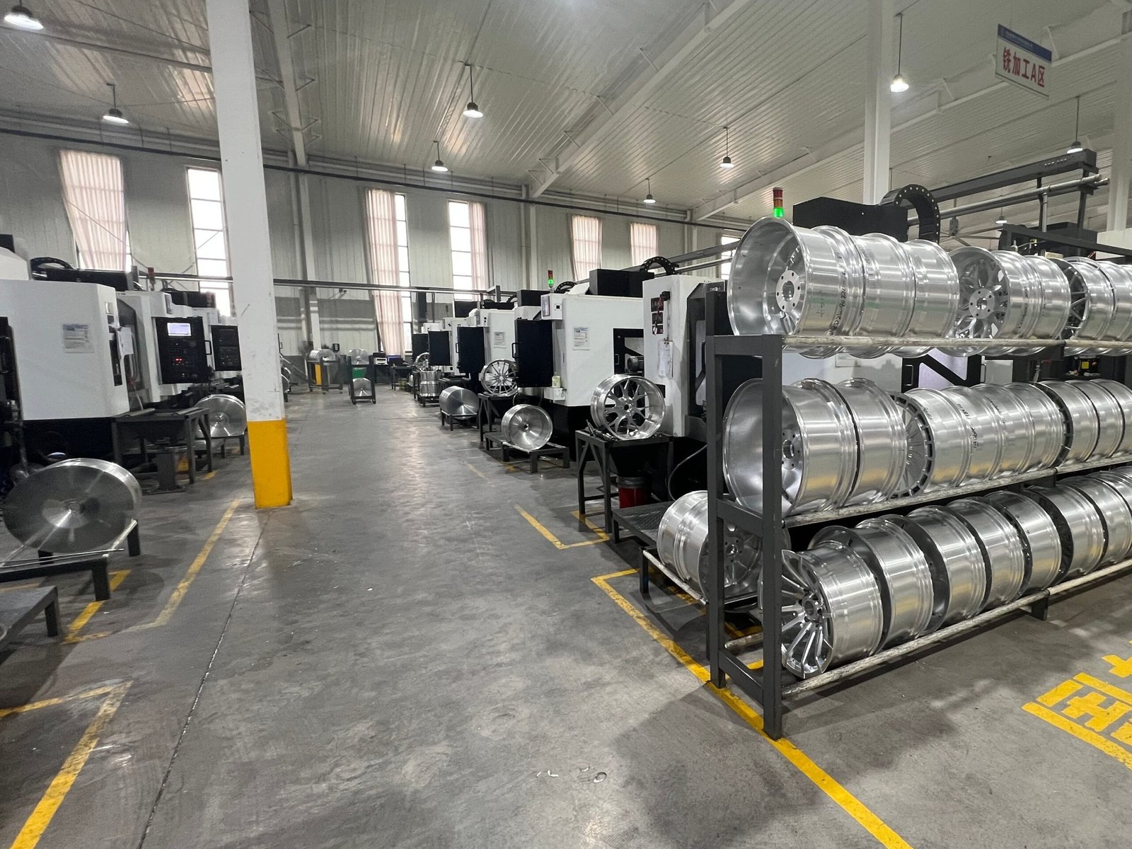 Multi-axis CNC machines cutting forged wheels at the group plant
