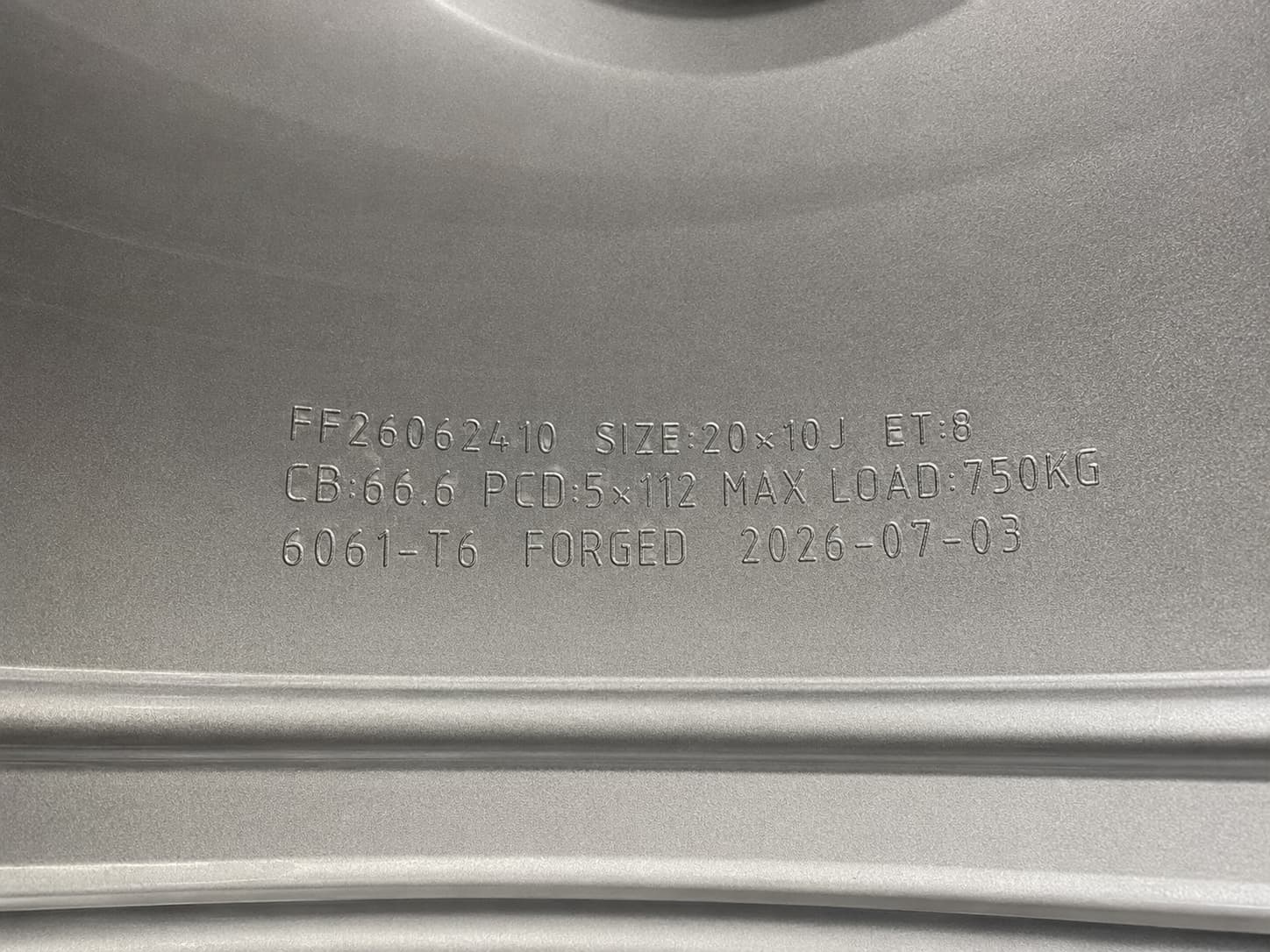 Serial number, size, ET, centre bore, PCD, max load and 6061-T6 alloy engraved on the inner barrel of a FLEXIFORGED forged wheel
