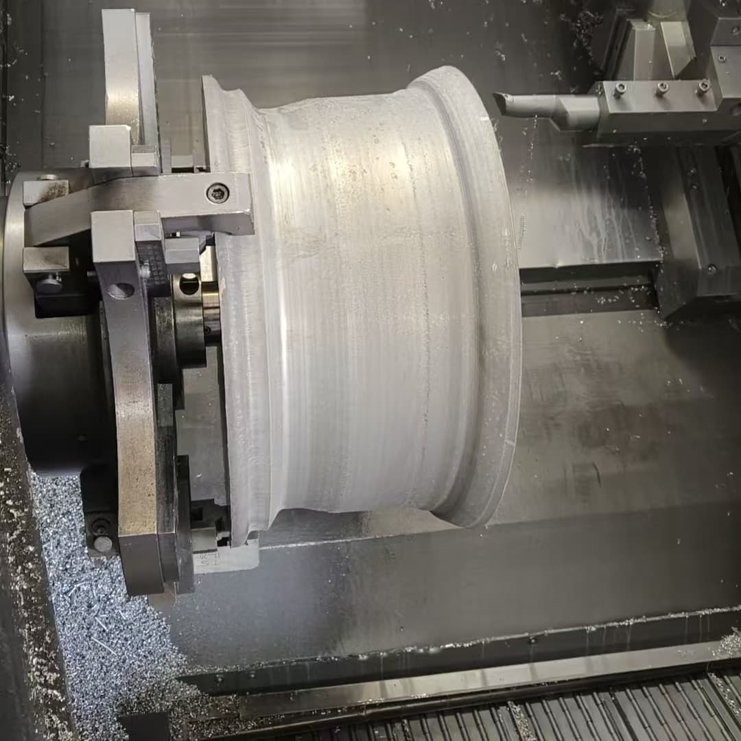 Turning a forged wheel blank on a CNC lathe at the group plant