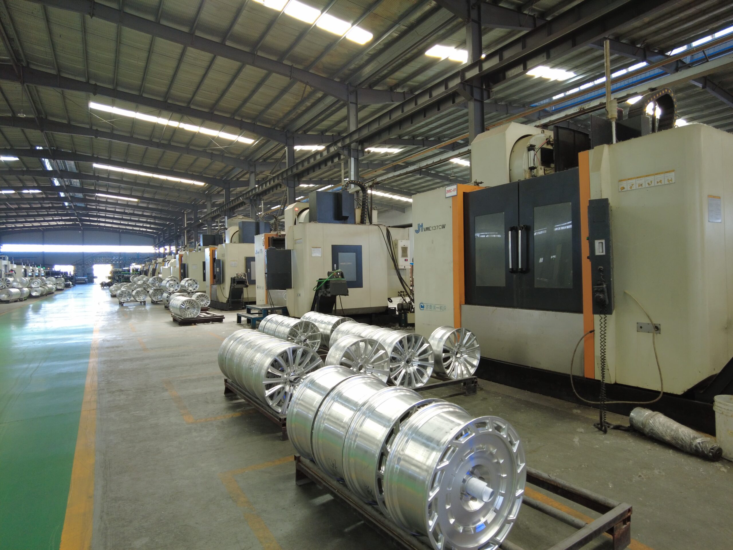 CNC machining of a forged aluminium wheel blank in the FLEXIFORGED forged wheel manufacturer machining hall in Chongqing China
