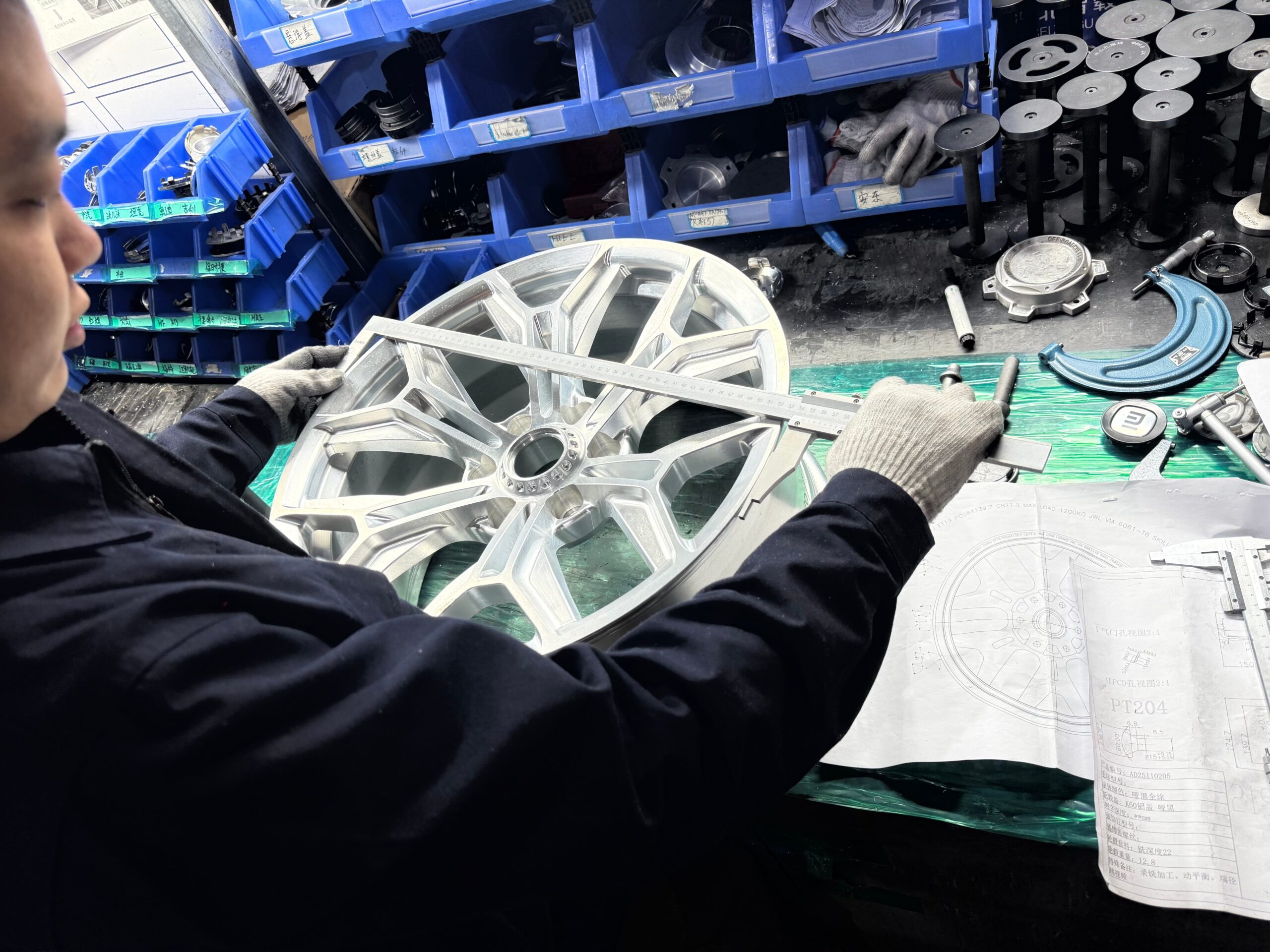 Quality control check of a forged wheel bolt circle and centre bore before shipment at FLEXIFORGED