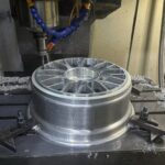 Gold Painted Face, Polished Outer Lip, Machined Silver Inner Barrel surface texture detail on forged aluminium wheel