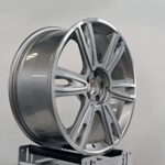 silver with machined face surface texture detail on forged aluminium wheel